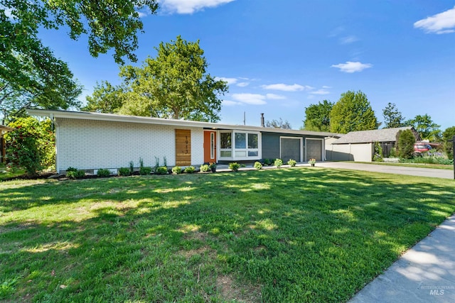 1913 W Suncrest Dr, Boise, ID 83705 - view of front of house featuring a garage, driveway, brick siding, and a front lawn