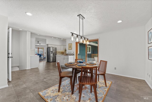 1913 W Suncrest Dr, Boise, ID 83705 - dining space featuring a textured ceiling, recessed lighting, and baseboards
