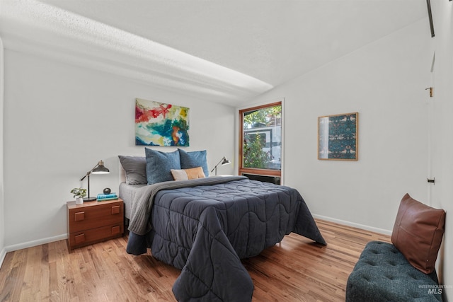 1913 W Suncrest Dr, Boise, ID 83705 - bedroom featuring baseboards, light wood-type flooring, and lofted ceiling