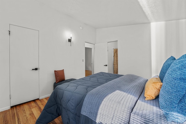 1913 W Suncrest Dr, Boise, ID 83705 - bedroom featuring wood finished floors and baseboards