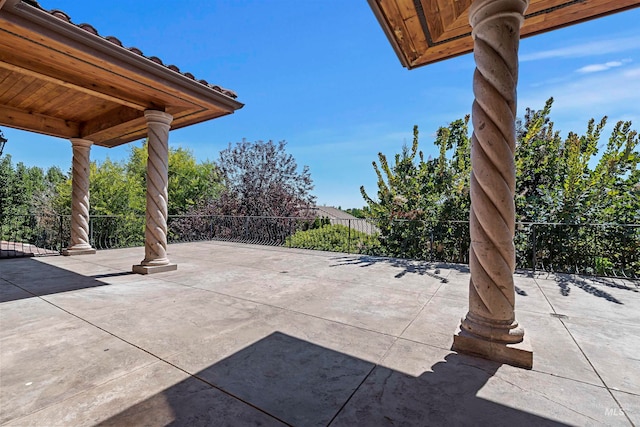 view of patio / terrace featuring fence