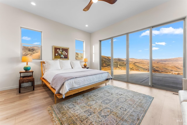 bedroom featuring baseboards, a ceiling fan, access to exterior, light wood-style floors, and recessed lighting