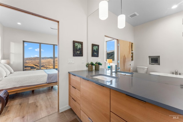 full bathroom featuring visible vents, toilet, ensuite bathroom, vanity, and tile patterned flooring