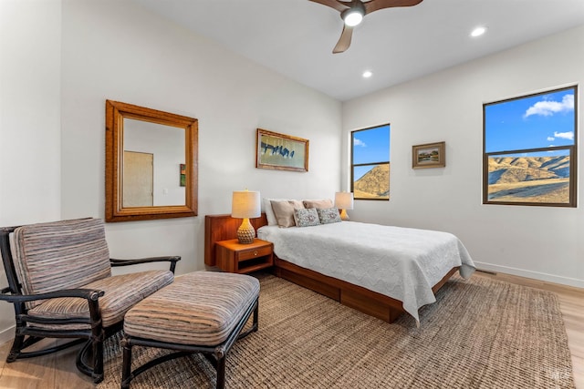 bedroom featuring light wood-type flooring, ceiling fan, baseboards, and recessed lighting