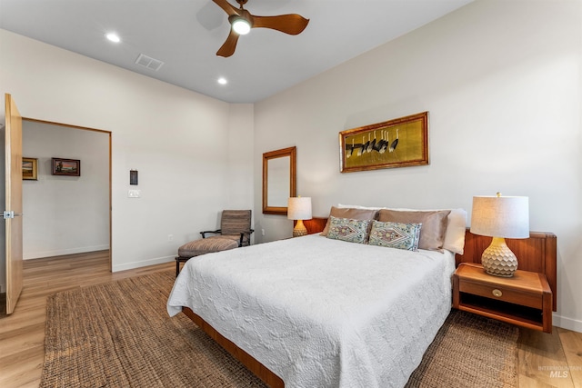 bedroom with recessed lighting, visible vents, light wood-style flooring, and baseboards