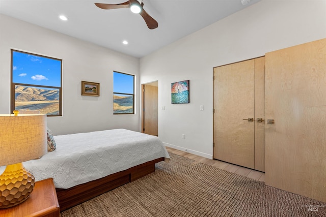 bedroom featuring light wood-type flooring, ceiling fan, baseboards, and recessed lighting