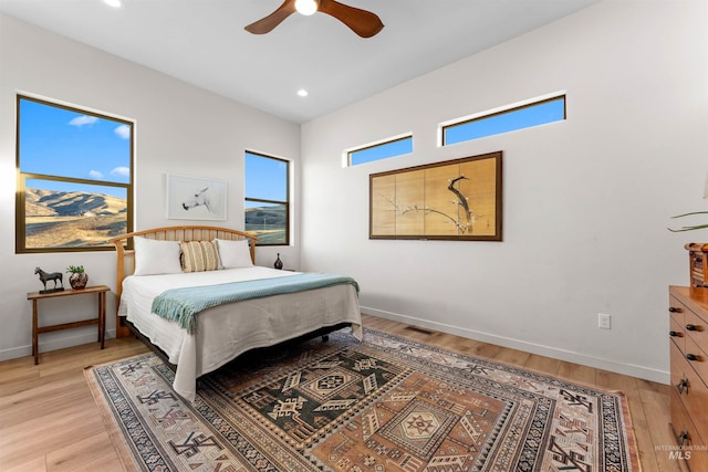 bedroom with recessed lighting, baseboards, visible vents, and light wood finished floors