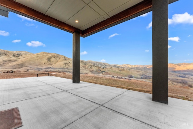 view of patio with a mountain view