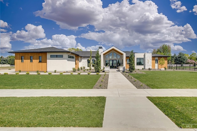 680 N Delehaye Ave, Eagle, ID 83616 - view of front of property featuring a front lawn, fence, stone siding, french doors, and a chimney
