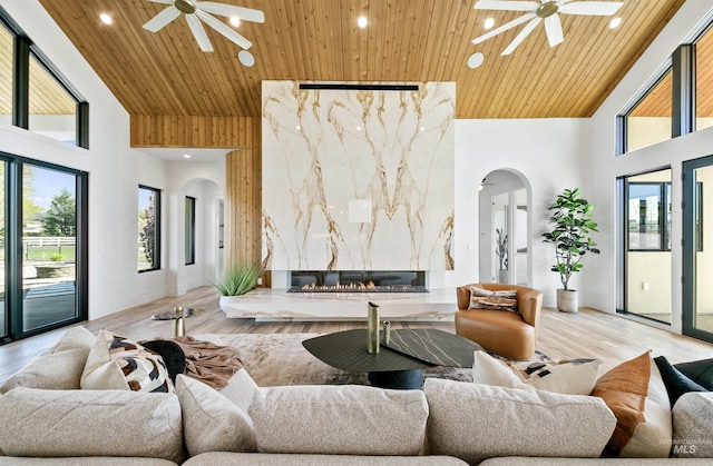 680 N Delehaye Ave, Eagle, ID 83616 - living room with a ceiling fan, arched walkways, and high vaulted ceiling