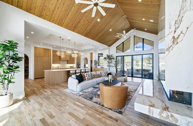 680 N Delehaye Ave, Eagle, ID 83616 - living area with a ceiling fan, arched walkways, high vaulted ceiling, wooden ceiling, and recessed lighting