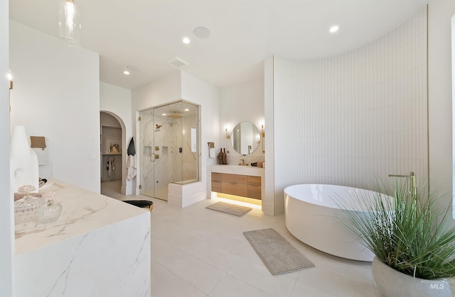 680 N Delehaye Ave, Eagle, ID 83616 - full bath with a freestanding tub, a stall shower, two vanities, and tile walls