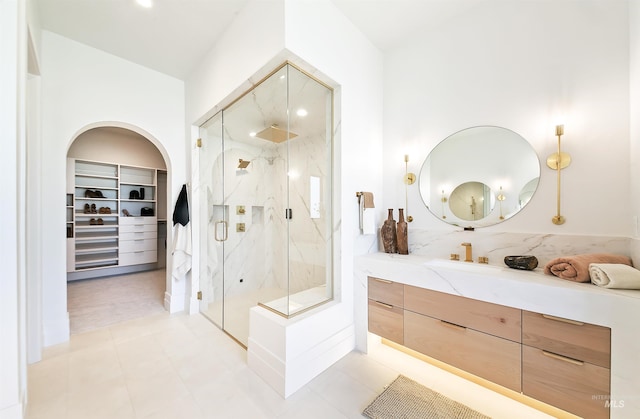 680 N Delehaye Ave, Eagle, ID 83616 - full bathroom featuring a walk in closet, a marble finish shower, and vanity