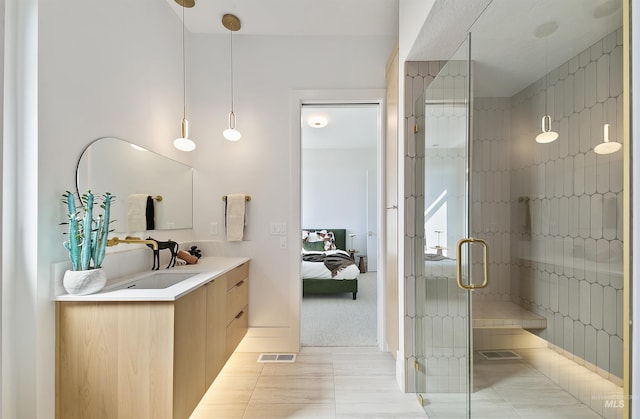 680 N Delehaye Ave, Eagle, ID 83616 - ensuite bathroom featuring visible vents, vanity, ensuite bath, tile patterned floors, and a stall shower