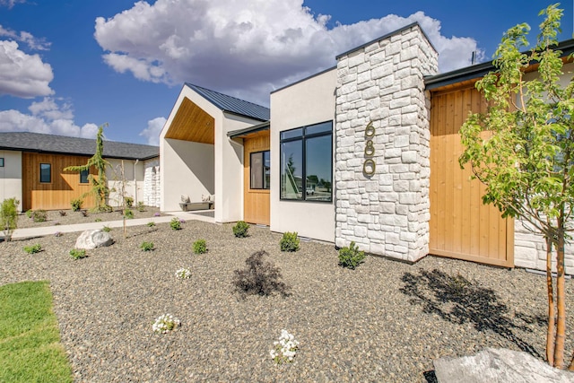 680 N Delehaye Ave, Eagle, ID 83616 - modern home featuring stucco siding and metal roof