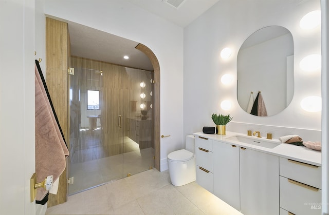 680 N Delehaye Ave, Eagle, ID 83616 - full bathroom with tile patterned flooring, vanity, toilet, visible vents, and a stall shower