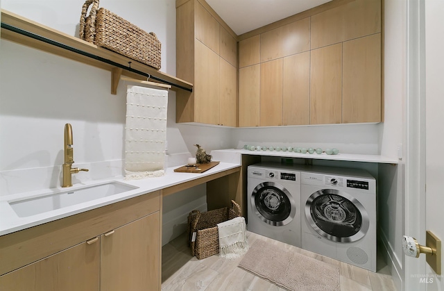 680 N Delehaye Ave, Eagle, ID 83616 - laundry area with a sink, washing machine and dryer, and cabinet space