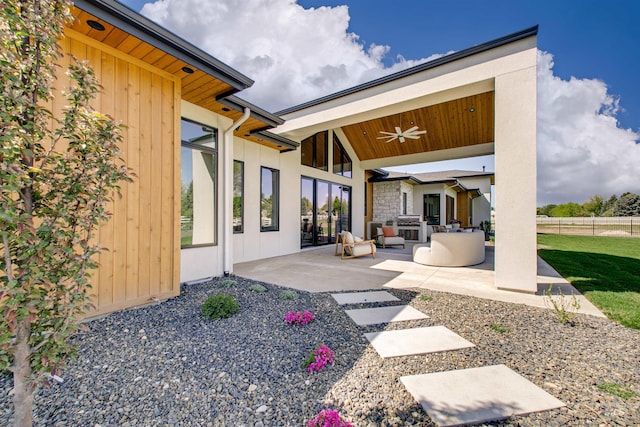 680 N Delehaye Ave, Eagle, ID 83616 - rear view of house with fence, outdoor lounge area, a ceiling fan, and a patio area
