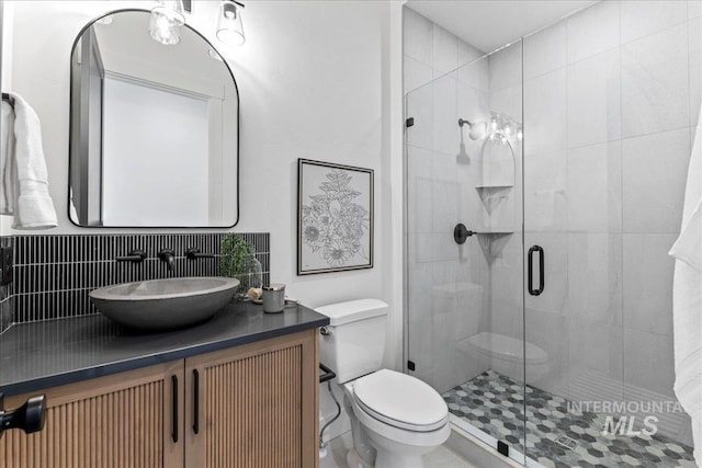 3436 N Mayberry Way, Eagle, ID 83616 - full bath featuring vanity, a stall shower, toilet, and tasteful backsplash