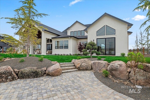 3436 N Mayberry Way, Eagle, ID 83616 - rear view of house featuring a patio, stucco siding, a yard, and fence