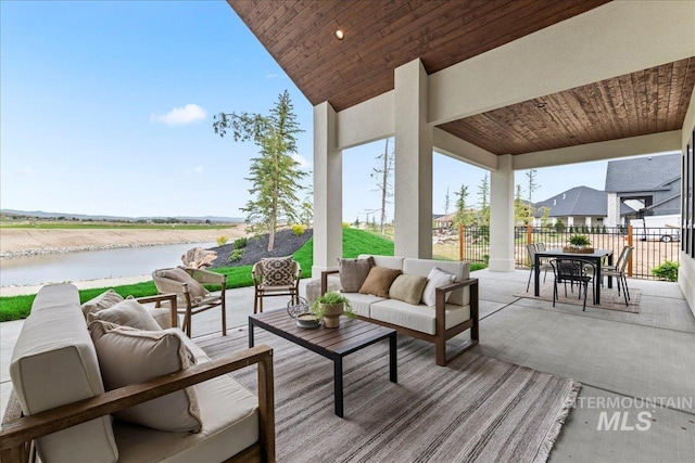 3436 N Mayberry Way, Eagle, ID 83616 - view of patio featuring a water view, outdoor lounge area, fence, and outdoor dining space