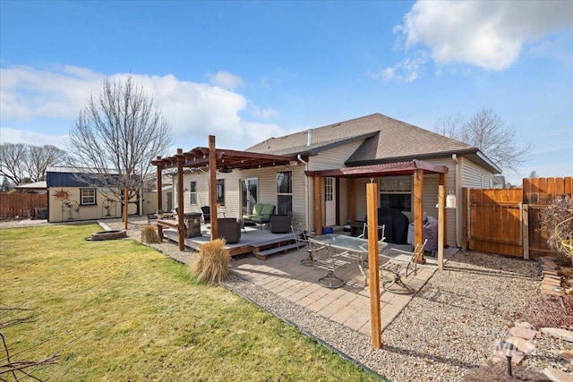 back of property featuring a yard, a patio area, a fenced backyard, and a pergola