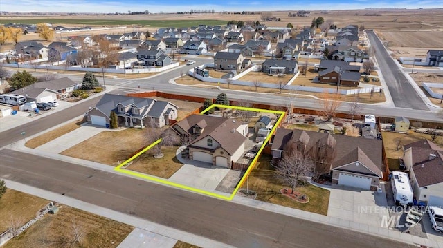 birds eye view of property with a residential view