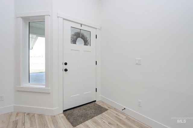 foyer entrance featuring light wood-type flooring