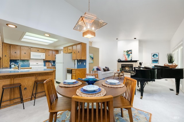 1574 E Sendero Ln, Boise, ID 83712 - dining area featuring a fireplace, light carpet, and recessed lighting