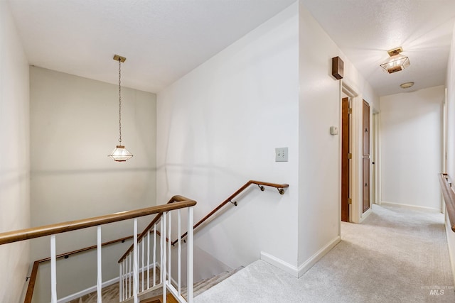 1574 E Sendero Ln, Boise, ID 83712 - stairway featuring carpet flooring and baseboards