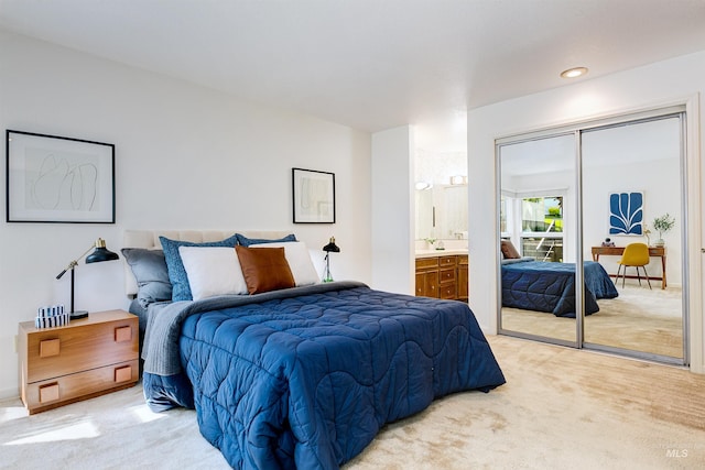 1574 E Sendero Ln, Boise, ID 83712 - bedroom featuring light colored carpet, a closet, and connected bathroom