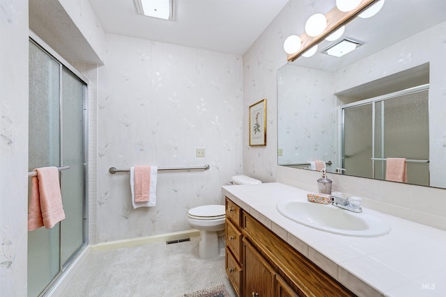 1574 E Sendero Ln, Boise, ID 83712 - bathroom with a shower stall, baseboards, wallpapered walls, and toilet