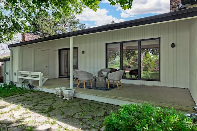 1574 E Sendero Ln, Boise, ID 83712 - back of property featuring a chimney and a deck