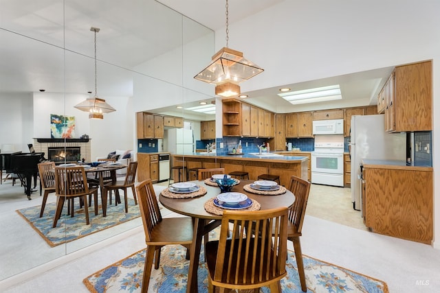 1574 E Sendero Ln, Boise, ID 83712 - dining room with a fireplace and recessed lighting