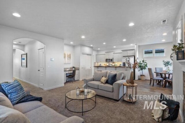 living room featuring light colored carpet