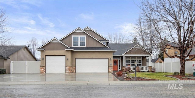 craftsman-style house with covered porch and a garage