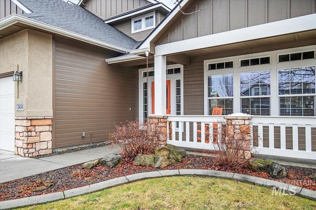 doorway to property with a porch