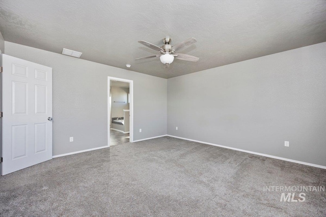 unfurnished bedroom featuring ceiling fan and a textured ceiling