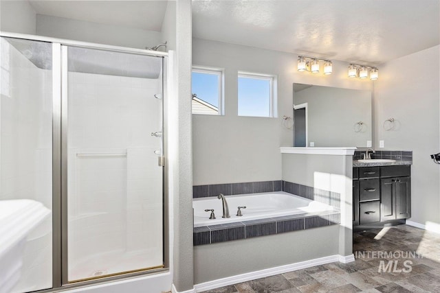 bathroom with separate shower and tub and vanity