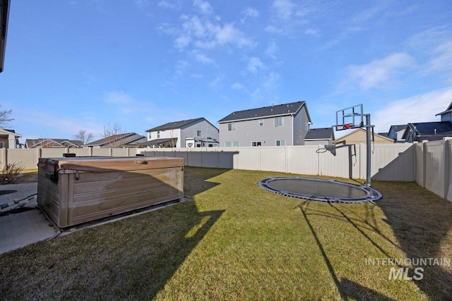 view of yard with a trampoline