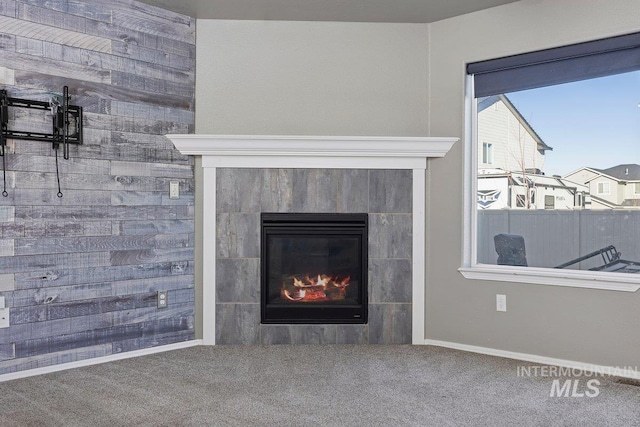 interior details with a fireplace and carpet floors