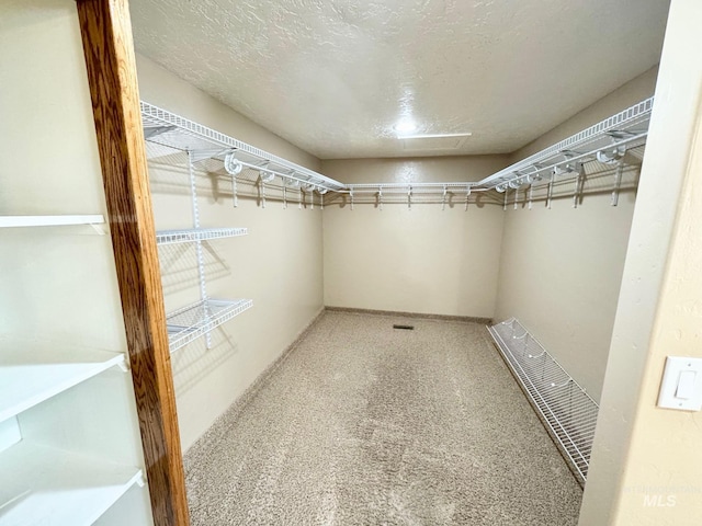 walk in closet featuring visible vents