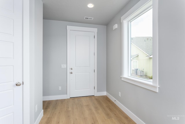 doorway to outside with light hardwood / wood-style floors