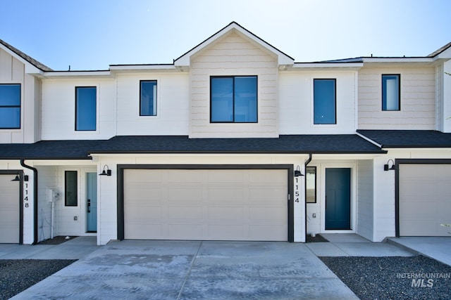 1154 S Barberry Pl, Nampa, ID 83686 - multi unit property featuring an attached garage, concrete driveway, and roof with shingles