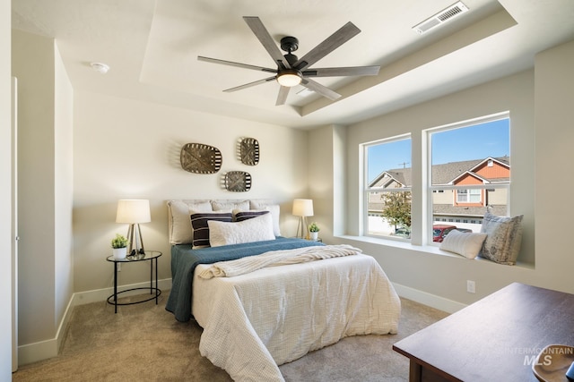 1154 S Barberry Pl, Nampa, ID 83686 - bedroom featuring carpet, a tray ceiling, baseboards, and ceiling fan