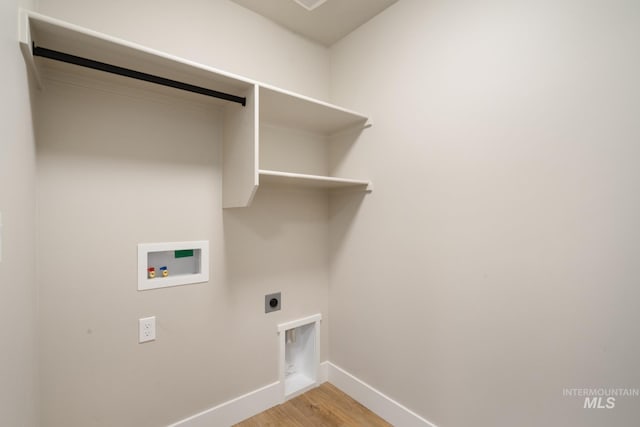 1154 S Barberry Pl, Nampa, ID 83686 - laundry room with washer hookup, baseboards, light wood-type flooring, and electric dryer hookup