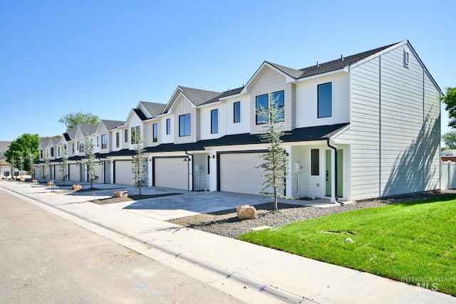 1154 S Barberry Pl, Nampa, ID 83686 - multi unit property featuring a garage, a residential view, driveway, and a front yard