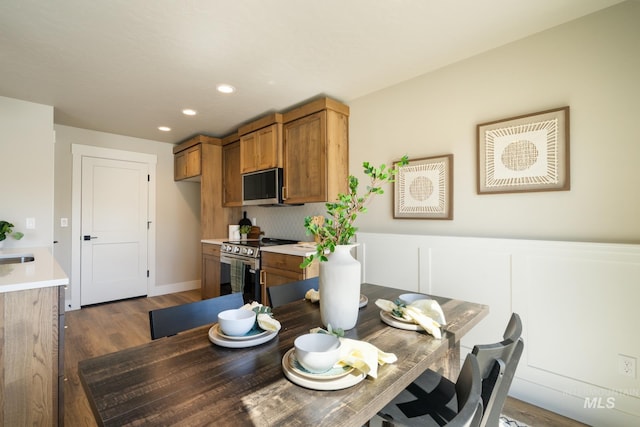 1154 S Barberry Pl, Nampa, ID 83686 - dining space featuring dark wood-type flooring, recessed lighting, and wainscoting