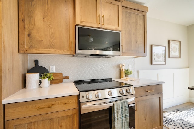 1154 S Barberry Pl, Nampa, ID 83686 - kitchen featuring appliances with stainless steel finishes, decorative backsplash, and light countertops