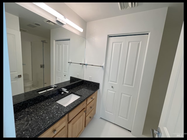 199 N Capitol Blvd, Boise, ID 83702 - full bath featuring vanity, a shower with shower door, and toilet